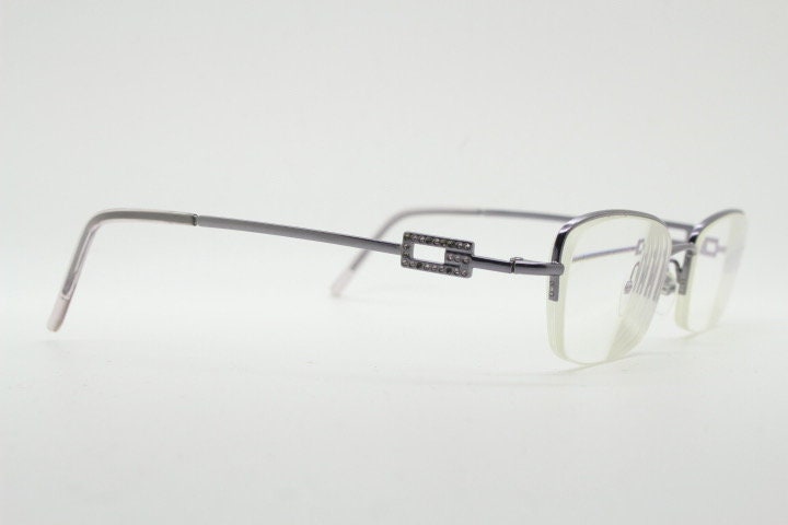 Gucci rectangular eye glasses made in Italy. Slim metal wire low profile optical half frame with diamante logo. Prescription eyeglasses. RX