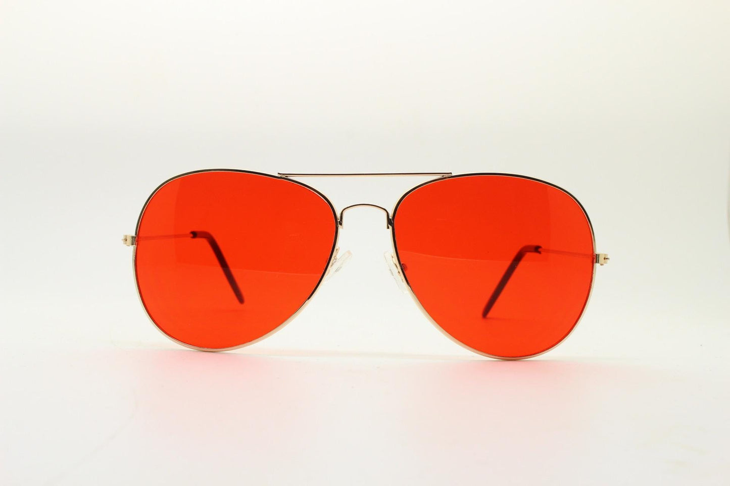 Y2K vintage teardrop aviator sunglasses. Gold chrome metal frame 70s design aviators with intense red lenses. 2000s. Unused NOS