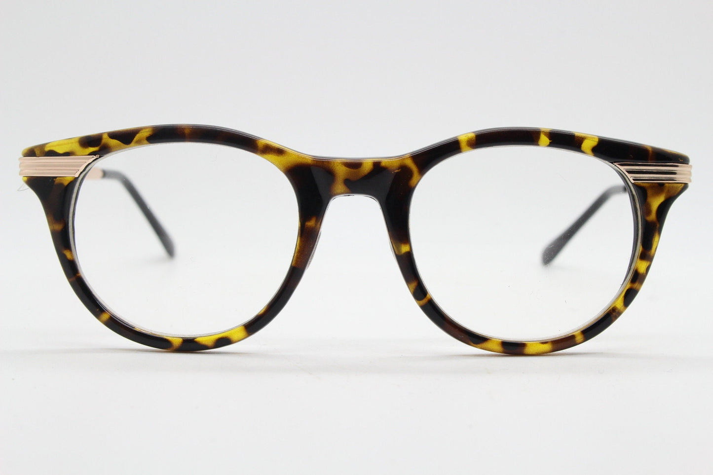 90s vintage cat eye glasses in tortoise with gold metal arms. 50s, 60s style cateye prescription optical frames. Clear lens eyeglasses. RX