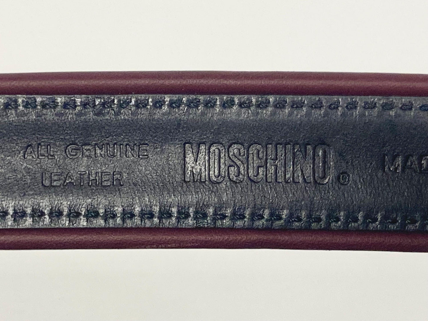 Moschino 90s vintage womens dress belt in oxblood and blue genuine leather with oval enamelled metal buckle. Made in Italy. BNWT. NOS
