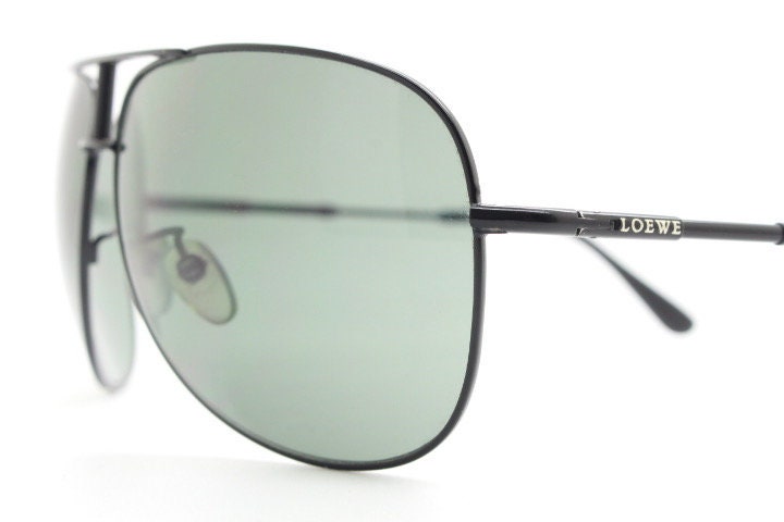 Loewe vintage aviator sunglasses in a tall black gloss frame with dark green lenses. Mens large teardrop pilot aviators. Y2K New Old Stock