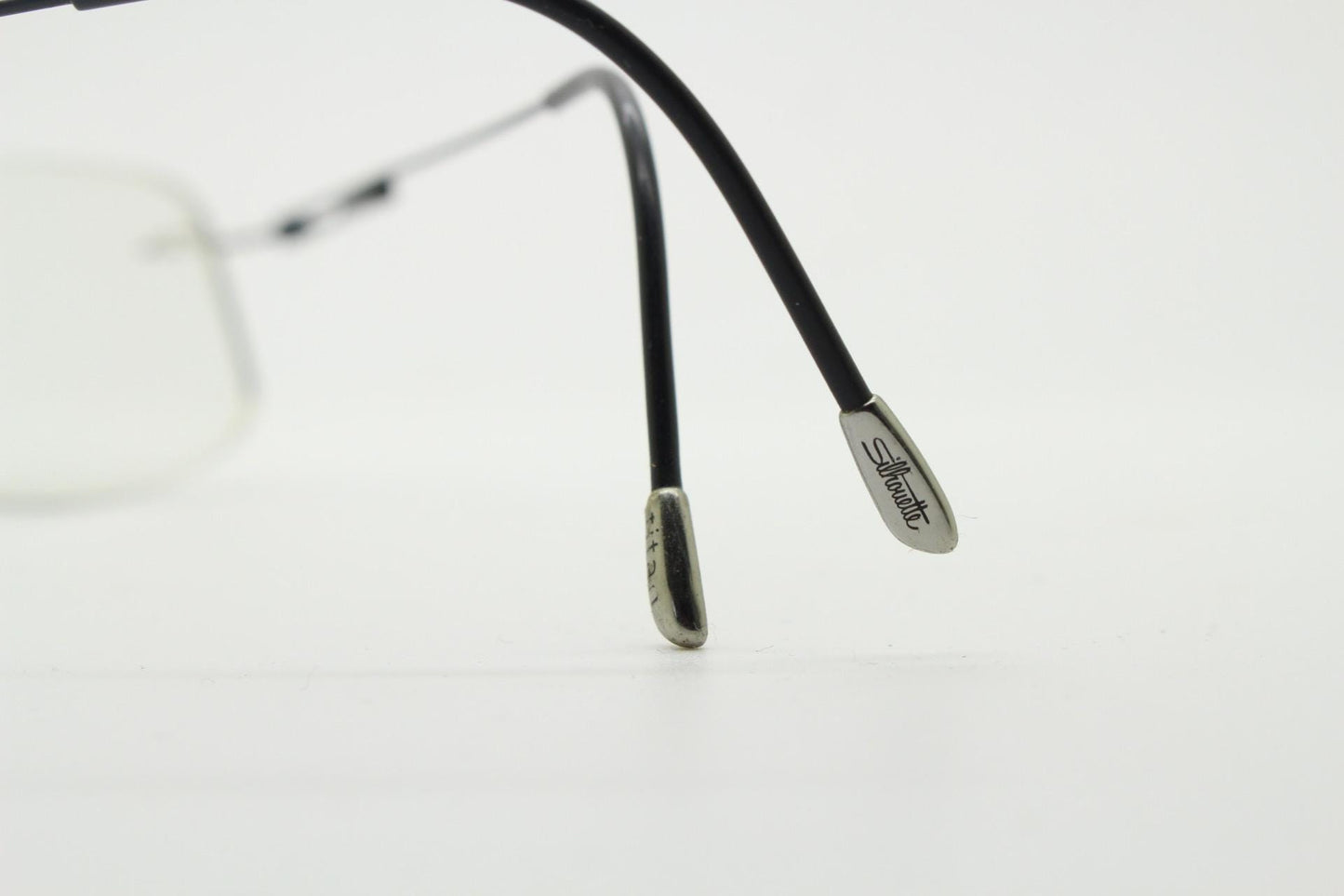Silhouette rectangular frameless eye glasses made in Austria. Extremely minimal lightweight grey titanium optical frame. Prescription RX