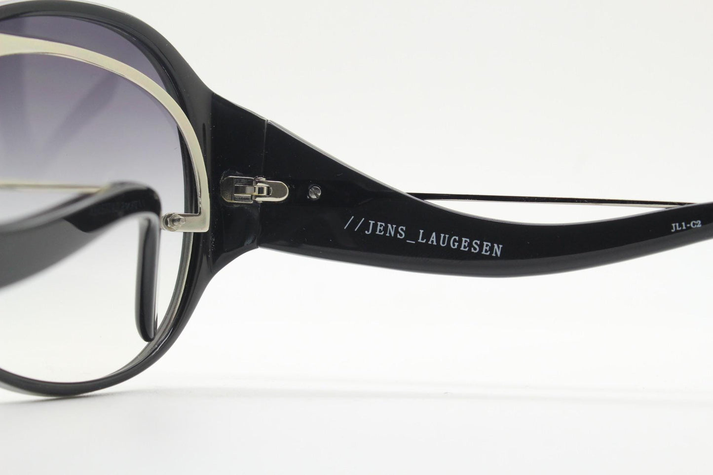 Jens Laugesen oversized sunglasses hand made by Linda Farrow. Black frame with undulating arms and smoky lenses. 70s design. Vintage. NOS