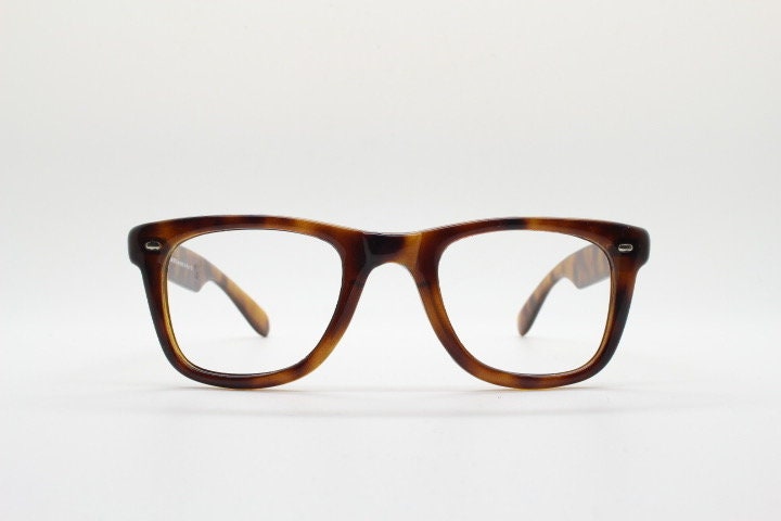 90s vintage wayfarer design eye glasses made in Italy. All time classic optical frames in mottled browns. Prescription RX eyeglasses. NOS