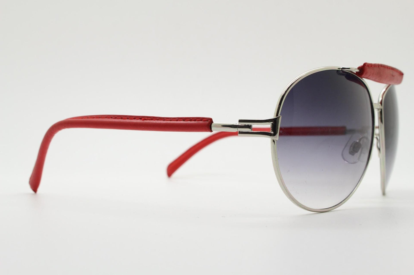 Y2K vintage aviator sunglasses. 2000's silver metal frame with exaggerated bridge in red trim. 70s racing design. 00's NOS aviators