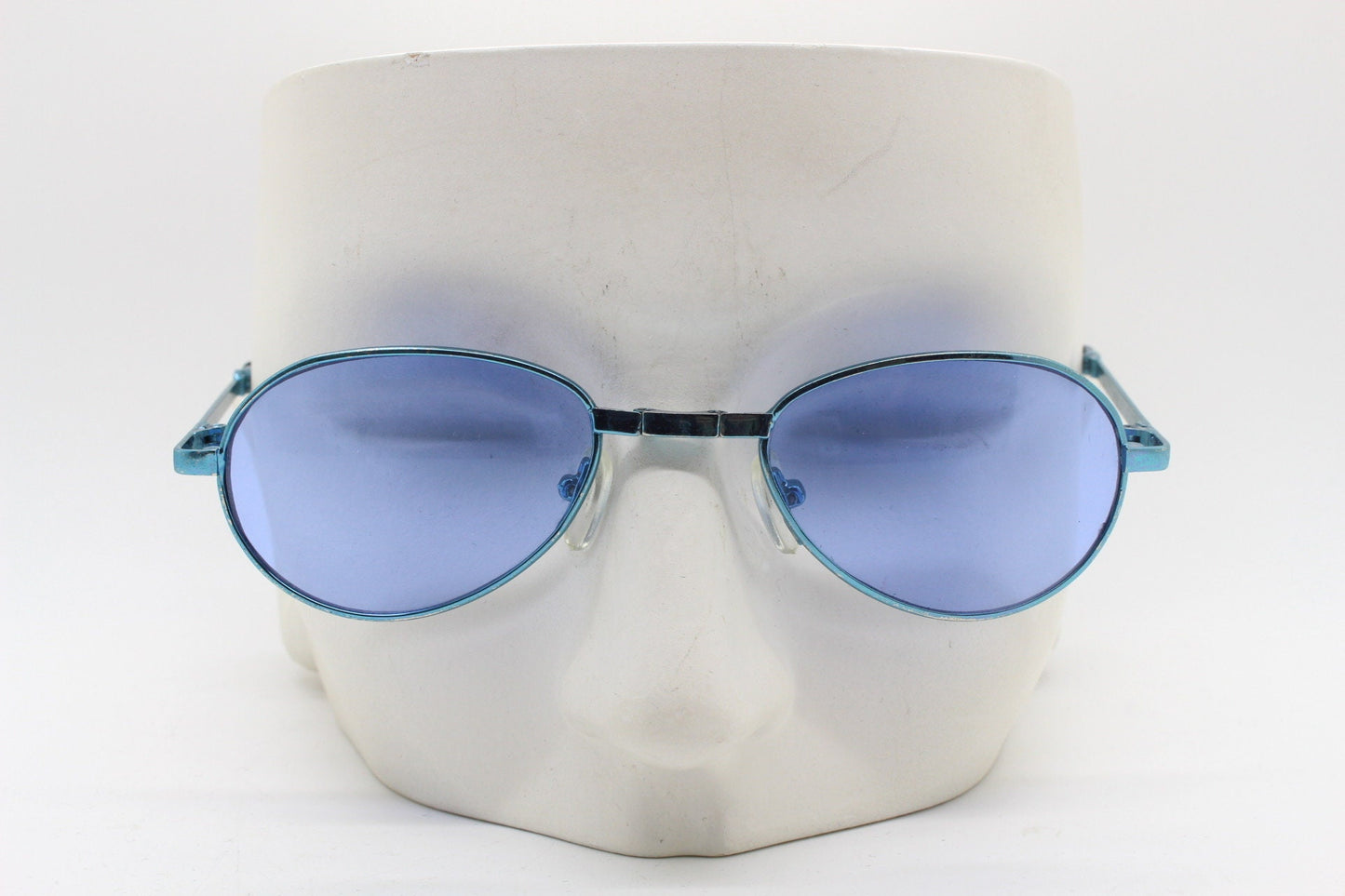 Y2K micro foldable oval sunglasses. Sky lenses in a small folding matching coloured compact frame. Folder. Rave 2000s. 90s NOS