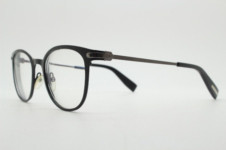 Trussardi modified cat eye glasses model VTR023. Womens flat black and gunmetal grey optical frame. Prescription. Vintage spectacles