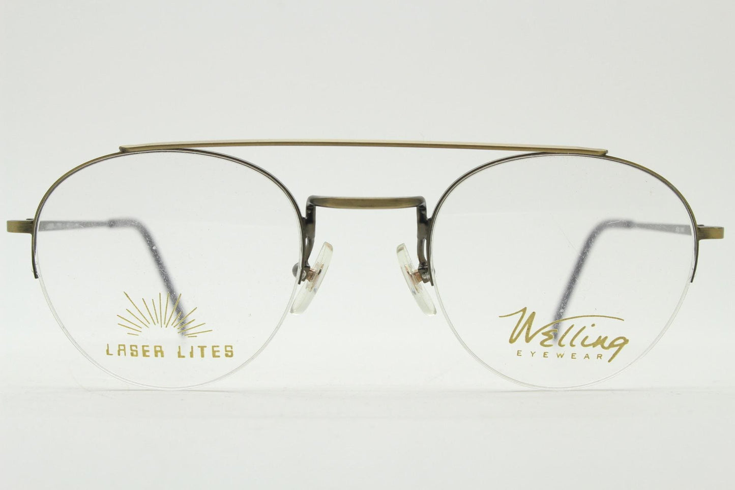 90s vintage round eye glasses made in Japan by Welling. Brushed bronze finish optical half frame. Prescription RX spectacles. NOS