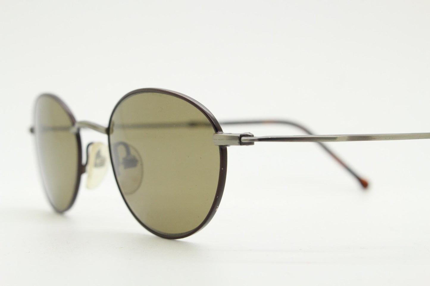 90s oval vintage metal sunglasses. Minimal satin finish bronze and brown metal frame with kinked curving arms. Steampunk. Unused NOS