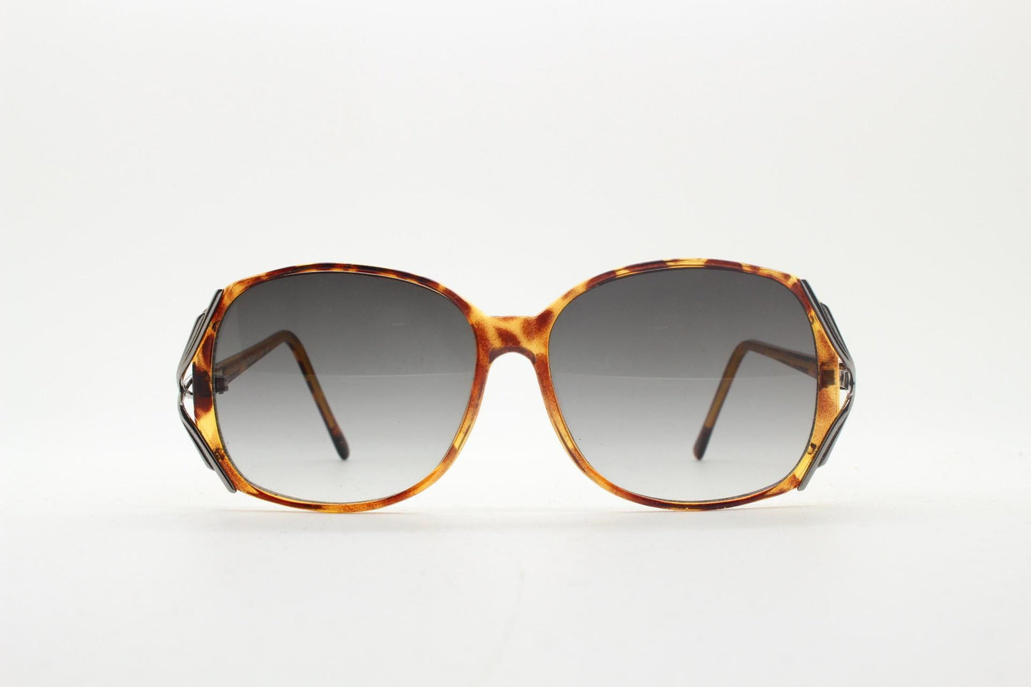 80s vintage square sunglasses. Womens honey tortoise frame with dynamic metal  forked side joints and graduating lenses. 70s. Unused NOS