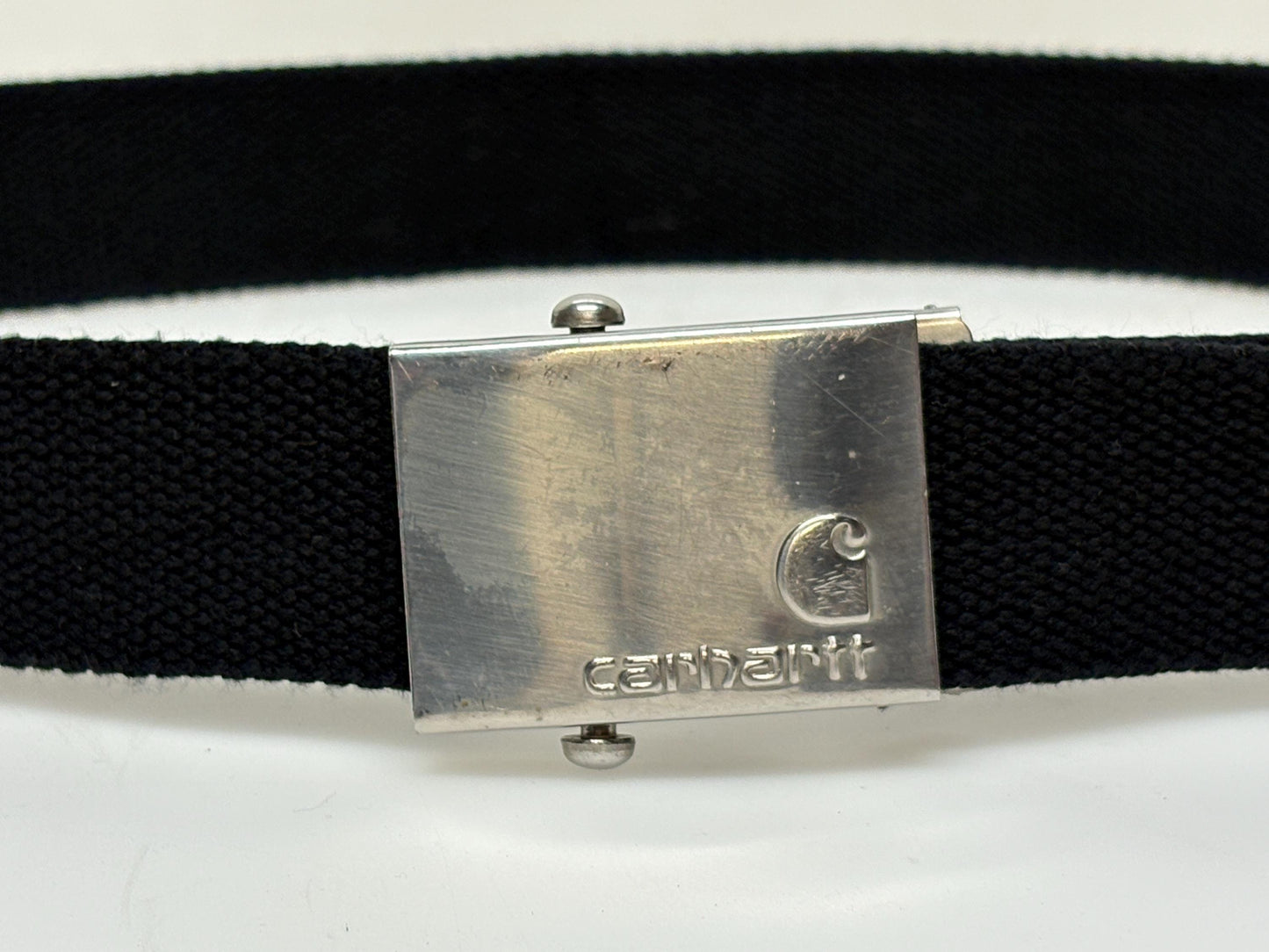 Carharrt vintage canvas army style belt buckle with 2 belts . One black plus one khaki green. no holes format. Slide lock . Fully adjustable