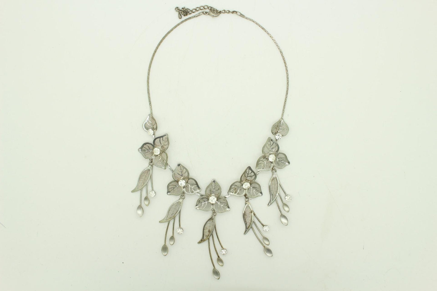 90s vintage extensive statement flower chain necklace. Full breasted array of mesh backed petals and dangling leaves with diamante centres
