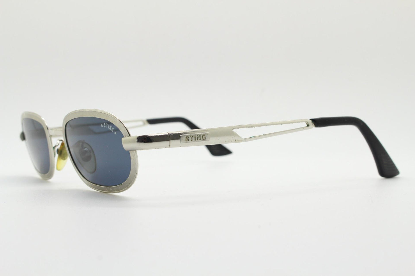 Sting 90s vintage oval sunglasses. Minimal 'Industrial tech' style in slightly small proportions that's quirky but in a quality finish