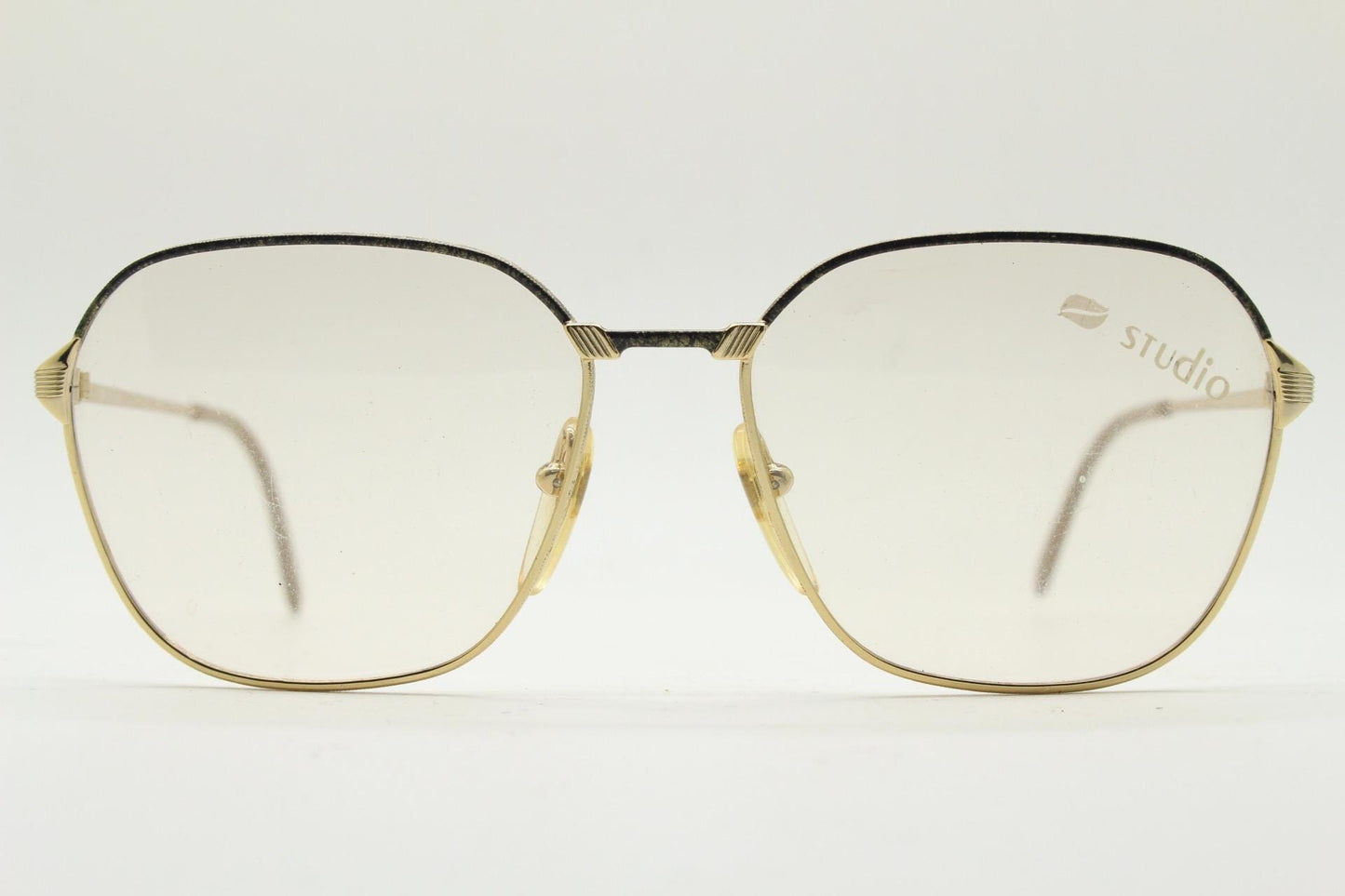 80s vintage square eye glasses made in Italy by Studio. Black and gold patterned metal optical frames in neat proportions. Unused NOS