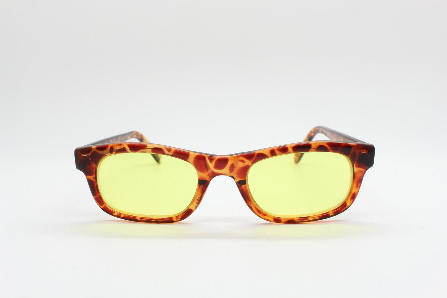 80s vintage rectangular sunglasses. Low profile 60s design tortoise frame with psychedelic light tone canary yellow lenses. BNWT Unused NOS