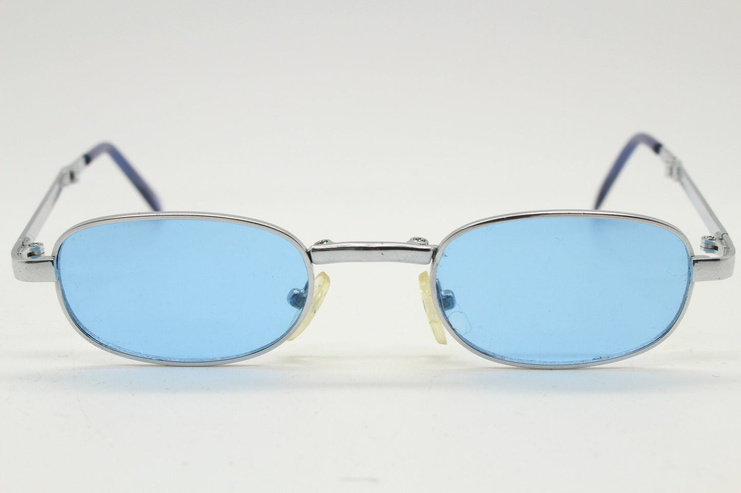 90s micro foldable oval sunglasses. Sky blue lenses in a small silver folding compact frame. Folder. Rave 2000s. Y2K. NOS