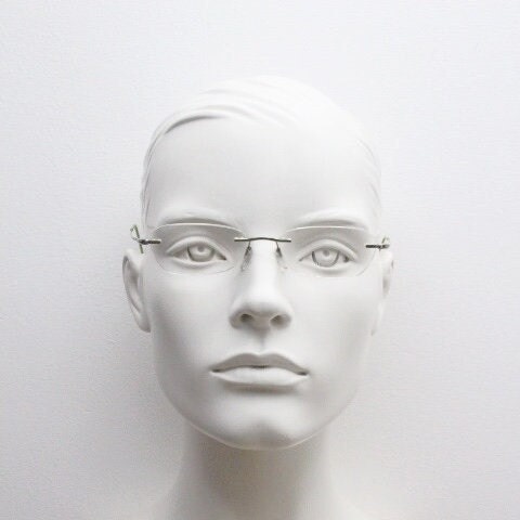 Silhouette rectangular frameless eye glasses made in Austria. Minimal lightweight optical frame with silver trim. Prescription RX