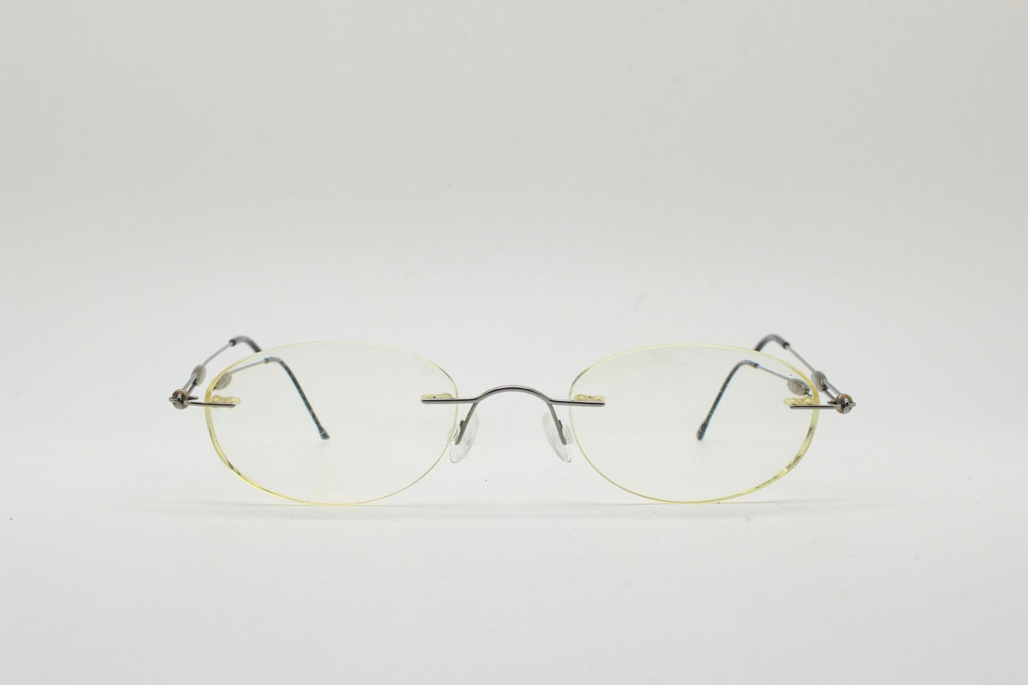 Silhouette vintage oval frameless eye glasses made in Austria. Minimal lightweight brown chrome optical frame. Prescription spectacles