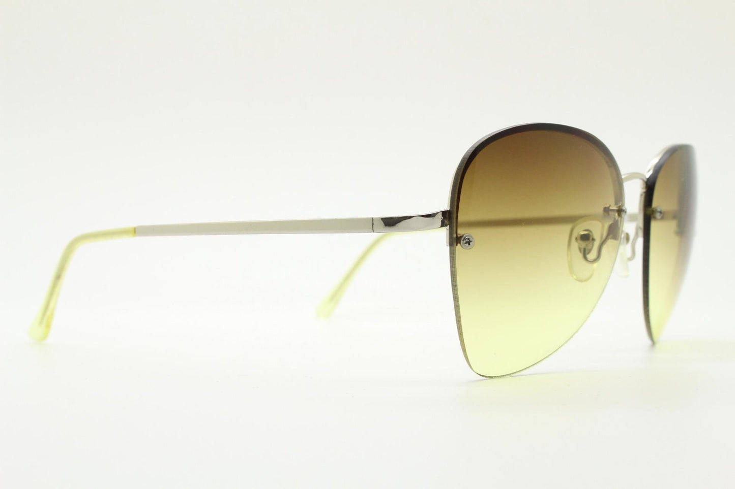90s vintage modified teardrop aviator sunglasses. Minimal metal silver chrome half frame with compelling lenses. Teardrop aviators. NOS
