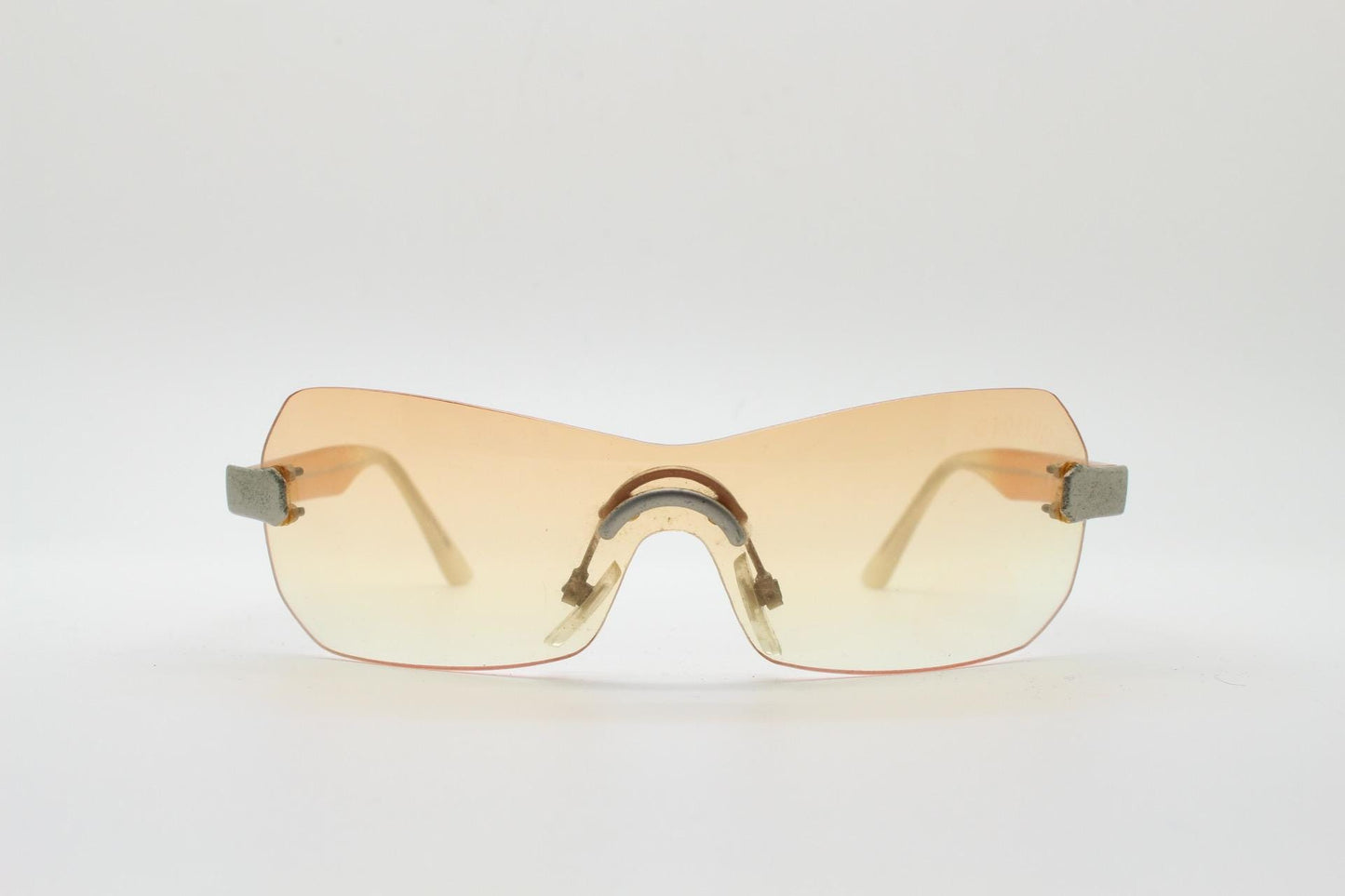 Y2K vintage frameless shield sunglasses. Dynamic 2000's light tone orange mono lens visor with matt silver trim. 00's Cosplay mini mask. NOS
