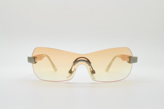 Y2K vintage frameless shield sunglasses. Dynamic 2000's light tone orange mono lens visor with matt silver trim. 00's Cosplay mini mask. NOS