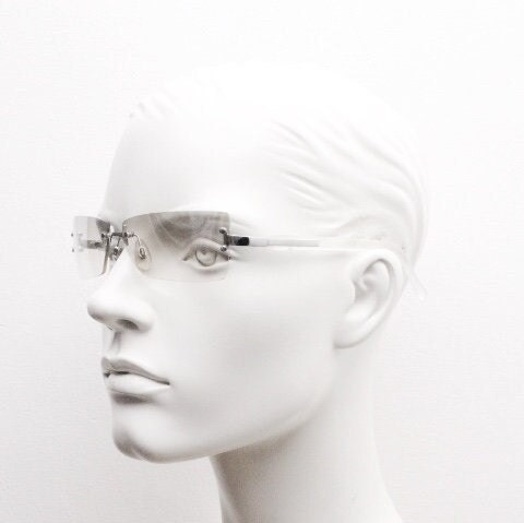 Y2K vintage  frameless sunglasses. Minimal light tone curved mirrored lenses with white frosted arms. 2000's. 90s. 00s. NOS