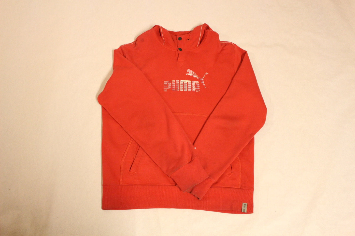 Puma red hoody with big chest logo. Unisex sports pullover sweatshirt with front muffler pockets. UK size L