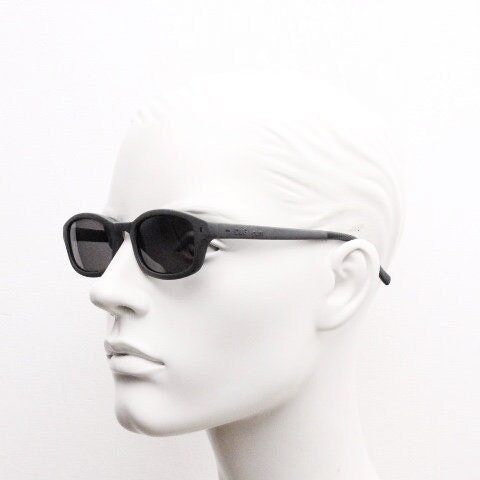 Dolce and Gabbana gum sunglasses made in Italy. Mens 90s vintage innovative flexible grey rubber frame with black lenses