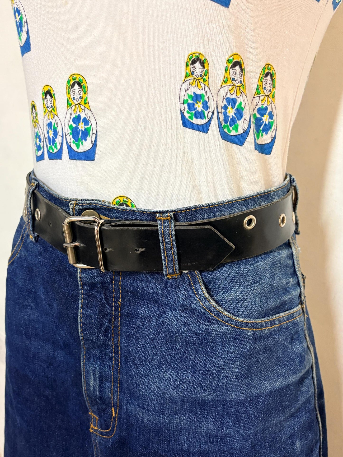 Y2k vintage womens jeans belt with silver buckle and scattered round lace holes. Thick black vinyl. Can be worn with a dress. 2000s NOS
