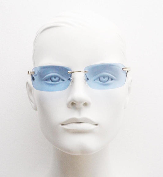 Y2K vintage frameless sky blue sunglasses. Minimalistic rectangular lenses with gold bridge and arms. 2000s club kids. 00's. 90s Rave