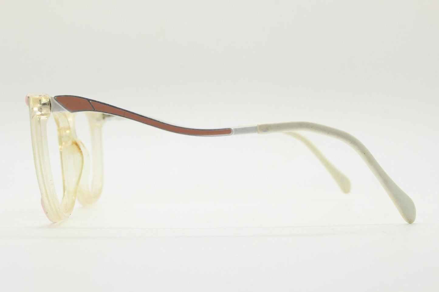 Invicta 80s vintage oversized cat eye glasses made in England. Ice white and pink acetate prescription optical frame with undulating arms