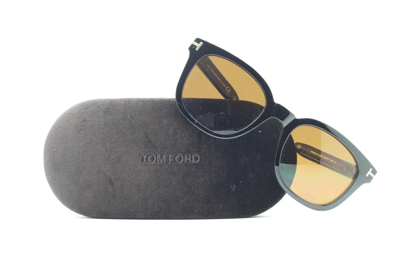 Tom Ford vintage wayfarer design sunglasses made in Italy. Slightly cat eye form in plain black gloss acetate with gold arms