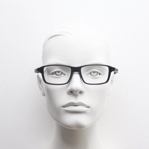 Tag Heuer rectangular eye glasses. Patented design made in France. Solid acetate optical frame with flexible rubber arms. Prescription RX