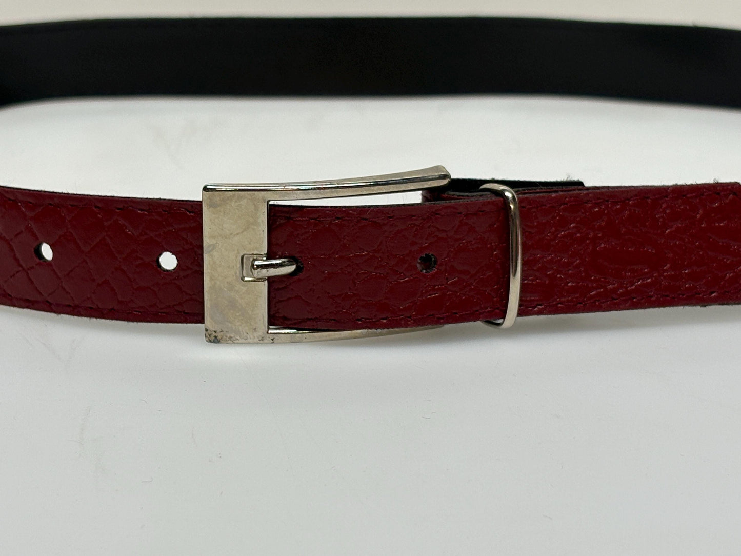 80s vintage womens embossed crocodile pattern 1" belt for jeans or trousers. Eco leather red vinyl with silver chrome buckle. Vegan