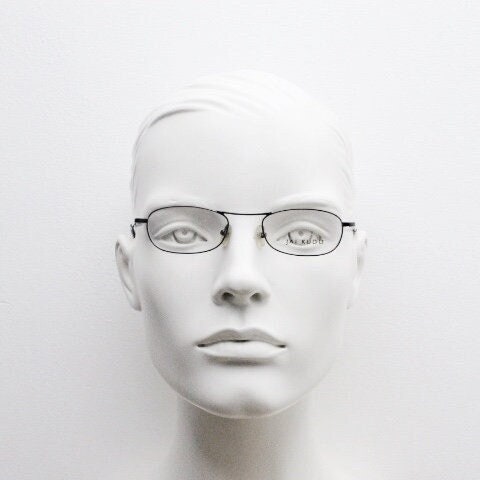 Jai Kudo 90s vintage oval eye glasses. Small low profile optical frames in charcoal grey chrome. Prescription eyeglasses. RX Spectacles
