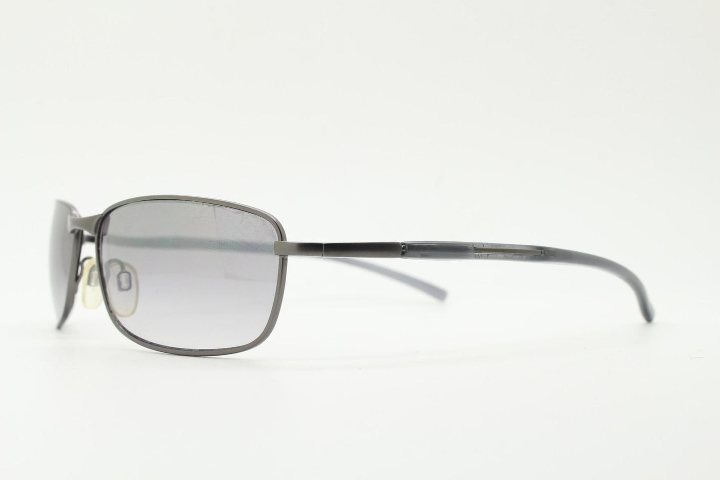 90s vintage curved rectangular sunglasses. Metal low profile frame in grey chrome with frosted arms and mirrored lenses. 2000's. Y2K NOS