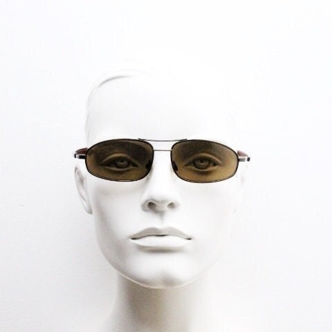 90s vintage abstract rectangular sunglasses. Metallic bronze satin finish frame with brown lenses and straight arms. 2000's. NOS aviator