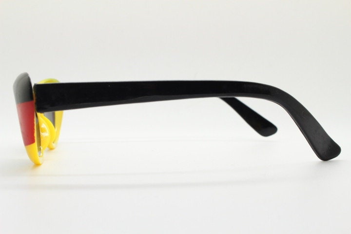 Vintage 90s oval cat eye sunglasses. Tastefully designed Womens black, red and yellow German flag cateye. Rockabilly cats eye. Deutschland
