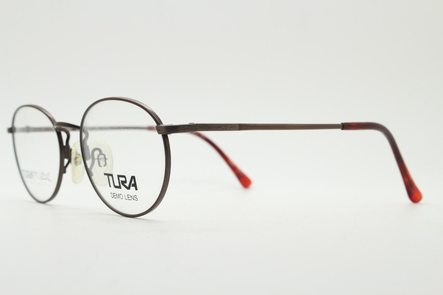 Tura 90s vintage oval eye glasses made in Japan. Satin metallic bronze finish optical frame in neat proportions. Prescription. Unused BNWT