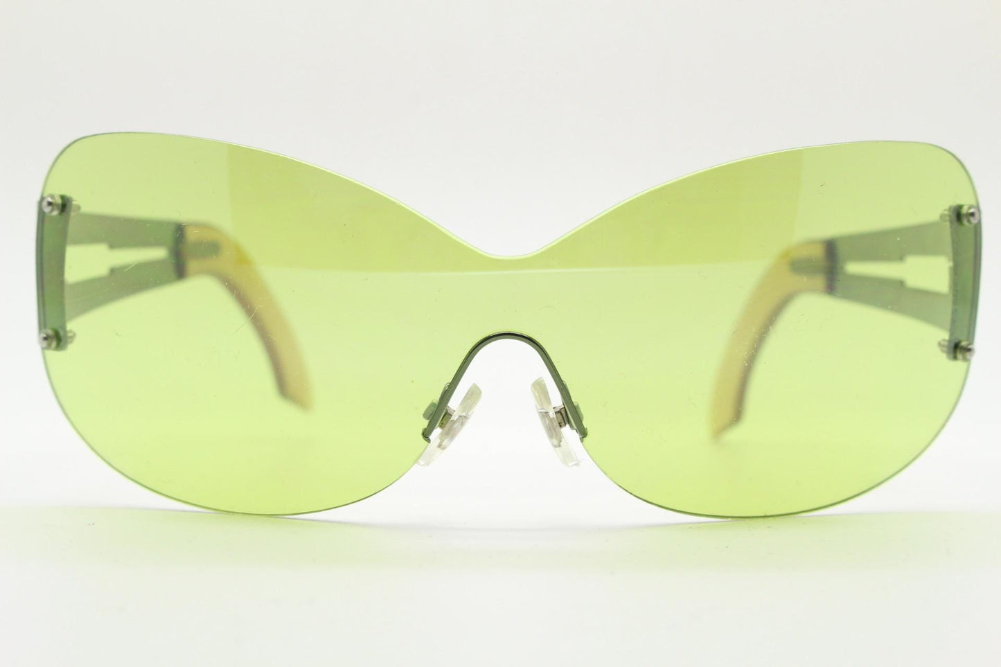 Y2K vintage frameless shield sunglasses. Dynamic 2000's green mono lens visor with matching coloured chrome arms. 00's Cosplay mini mask NOS