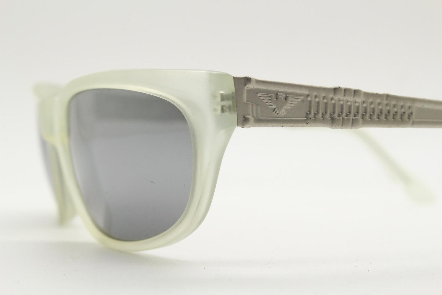 Dakota Smith vintage 90s futuristic sunglasses. Transparent frosted wrap around shield frame with mirror lenses and ornate arm patterns