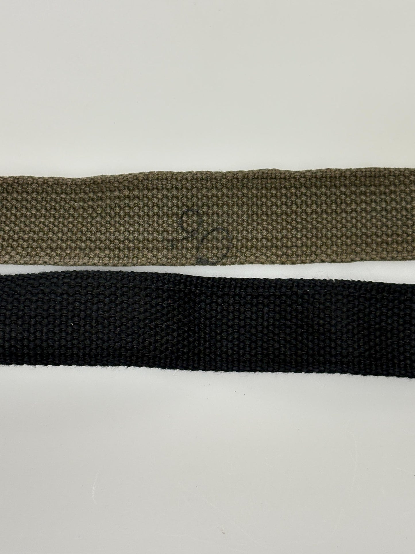 2 x bundle 80s vintage canvas army belts. One black plus one khaki green no holes format. Slide lock gold buckle. Webbing. Fully adjustable