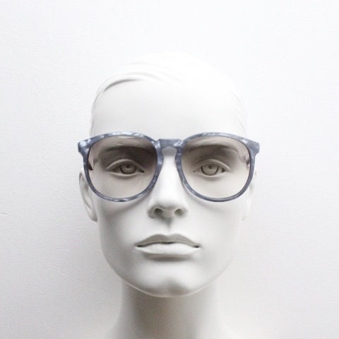 Michele L'Amy 80s vintage round sunglasses made in France. Lustrous marbled blue frame with keyhole bridge and graduating brown lenses