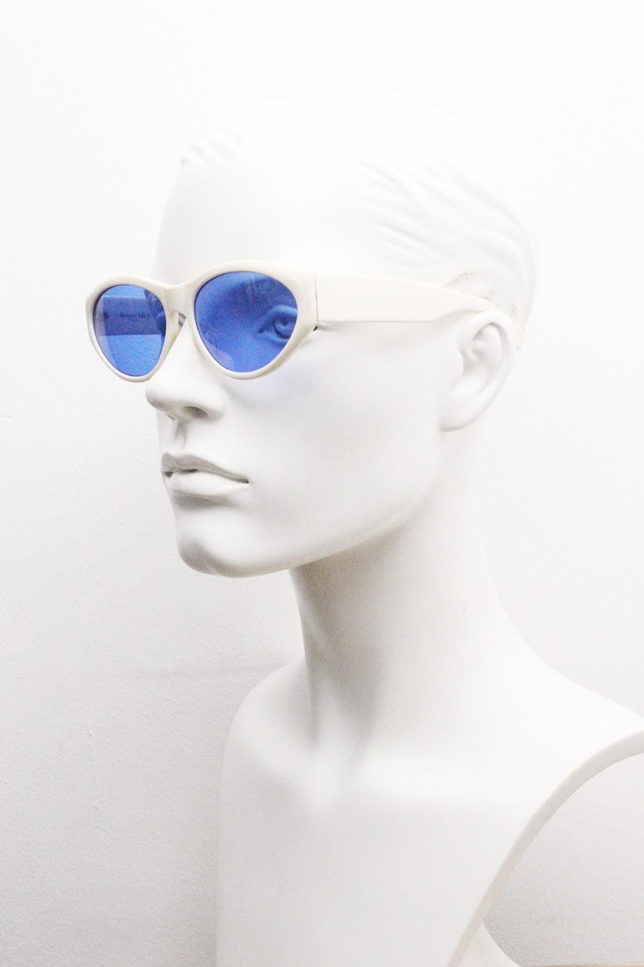 Benson and Ashley vintage 80s cat eye sunglasses hand made in England. 50s design white acetate cateye frame with cobalt blue lenses. NOS