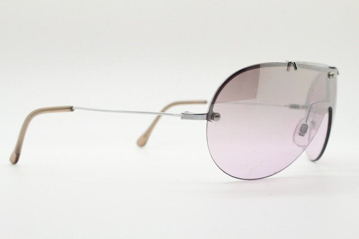 Y2K vintage visor shield sunglasses. Silver chrome half frame with pink wraparound mono lens and mirror glaze. Mini mask. 00's. 2000's NOS