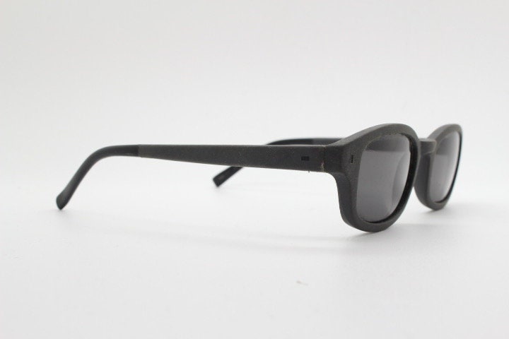 Dolce and Gabbana gum sunglasses made in Italy. Mens 90s vintage innovative flexible grey rubber frame with black lenses