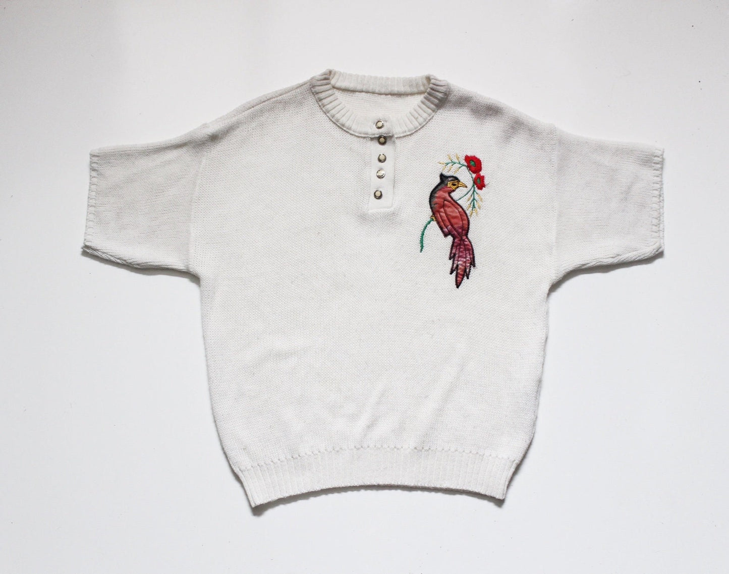 White 80s vintage knit jumper. Short sleeve womens sweater with exotic bird applique. Buttoned crew neck knitted pullover made in the UK