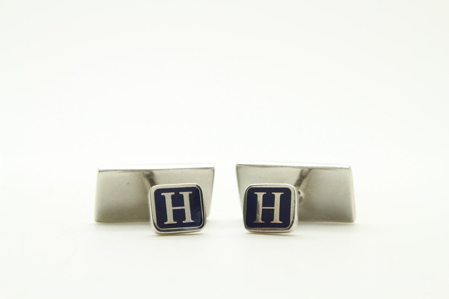 Vintage rectangular cuff links made in England by Herringbone. Solid metal construction with fine enamelled white, pink and peach tones. NOS