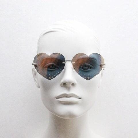 Kenzo mirror heart shaped frameless sunglasses model KZ40005U. Instant classic design with diamantes and big spell out arm logo. NOS