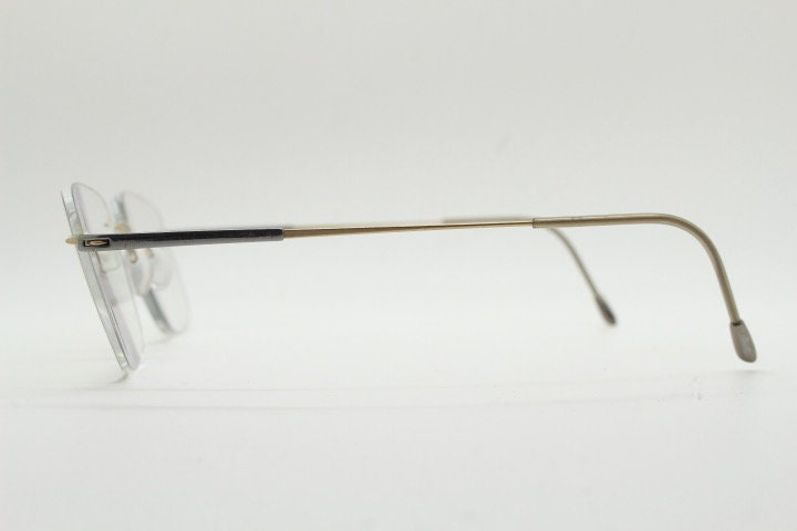 Silhouette rectangular frameless eye glasses model 7719 made in Austria. Minimal lightweight titanium optical frame. Prescription RX